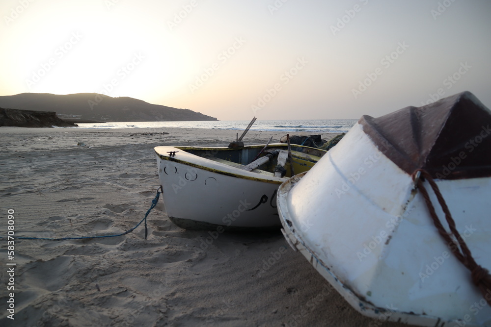 Fishing Boats on Beach at Sunset