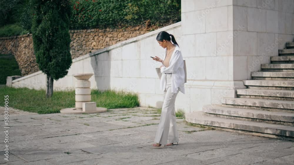 Business woman talking phone at square alone. Startupers shaking hands greeting Business woman talking phone at square alone. Startupers shaking hands greeting