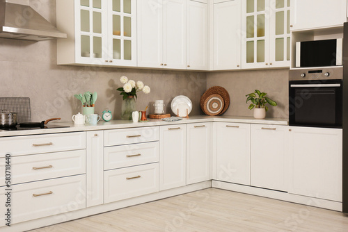 Beautiful kitchen interior with stylish modern furniture © New Africa