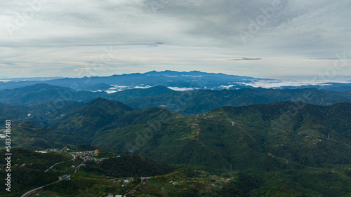 Farmland and village of farmers in the mountains. Borneo, Sabah, Malaysia.