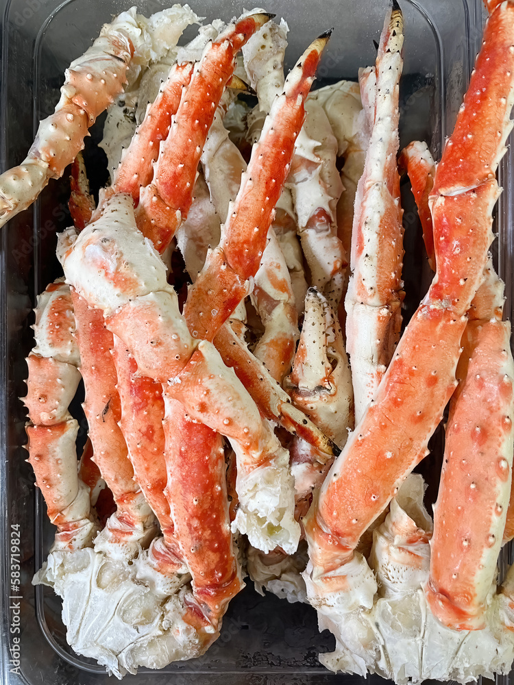 Delicious frozen king crab legs available at the fish shop Delicious frozen king crab legs available at the fish shop