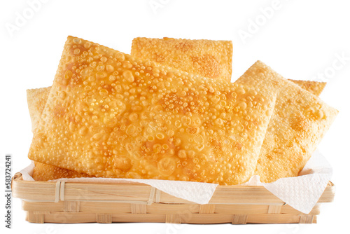 Fried Pastels, Brazilian Pastel de Feira, on a basket, transparent png background, isolated