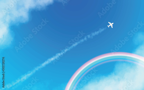 まっすぐのびた飛行機と飛行機雲　虹