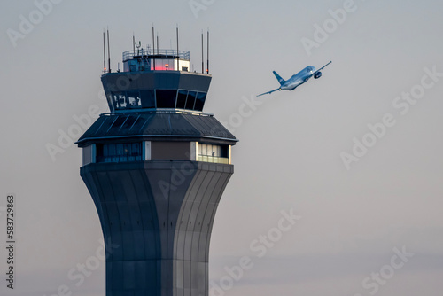 Airport control tower during takeoff airplane