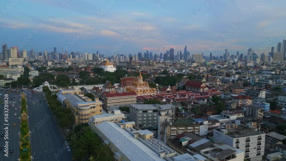 History and modernity meet in bangkok. Magic aerial view flight, buddhist temple Loha Prasat evening thailand 2022. wide orbit overview drone 4k uhd cinematic footage. History and modernity meet in bangkok. Magic aerial view flight, buddhist temple Loha Prasat evening thailand 2022. wide orbit overview drone 4k uhd cinematic footage.