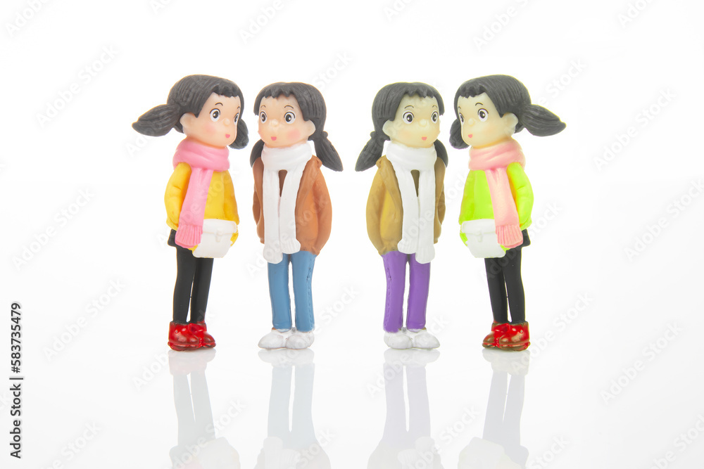 Fototapeta premium miniature people. figures for the game. cute girlfriends together on white background