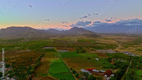 Matanzas city and surrounding landscape at sunset, Peravia in Dominican Republic. Aerial backward and sky for copy space  photo