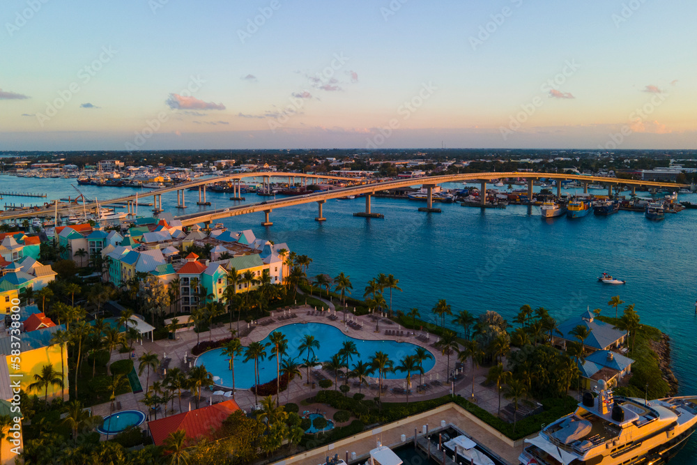 Harborside Villas at sunset aerial view and Paradise Island Bridge at Nassau Harbour, from Paradise Island, Bahamas.