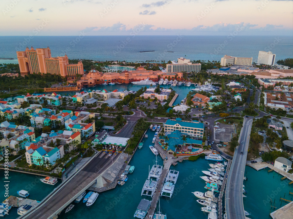 Harborside Villas aerial view at sunset with Atlantis Hotel at the background at Nassau Harbour, from Paradise Island, Bahamas.