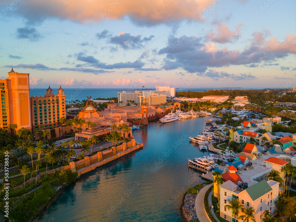 Nassau Potters Cay and downtown aerial view at sunset in Nassau Harbour, New Providence Island, Bahamas. 