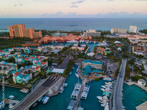 Harborside Villas aerial view at sunset with Atlantis Hotel at the background at Nassau Harbour, from Paradise Island, Bahamas.