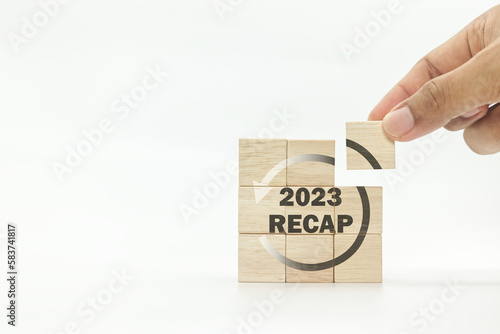 RECAP word icon on wooden cubes on white background and copy space. 2023 Recap economy, business, financial concept. For business planning.  photo