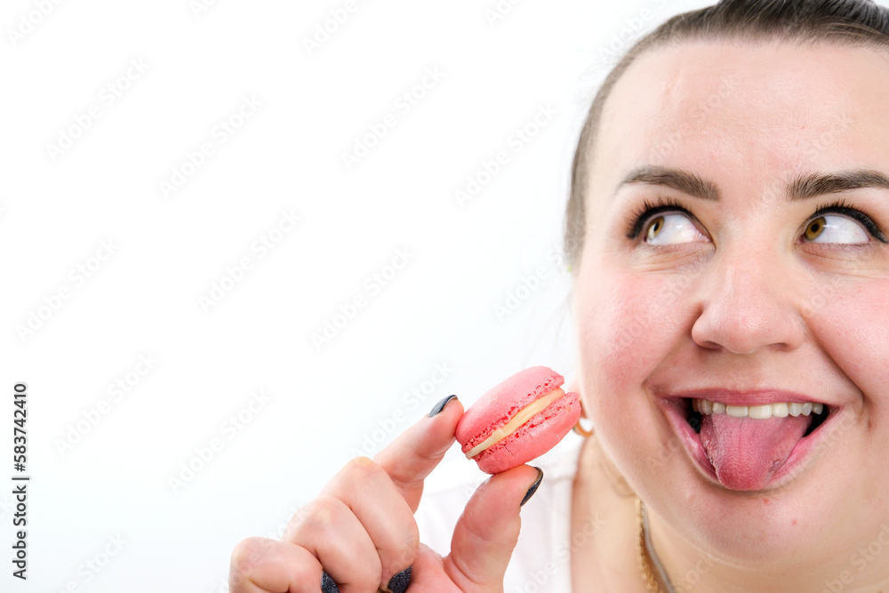 plump woman biting pink pasta laughing stuck out tongue raised her eyes up interesting funny on a white background place for text joyful plump woman biting pink pasta laughing stuck out tongue raised her eyes up interesting funny on a white background place for text joyful