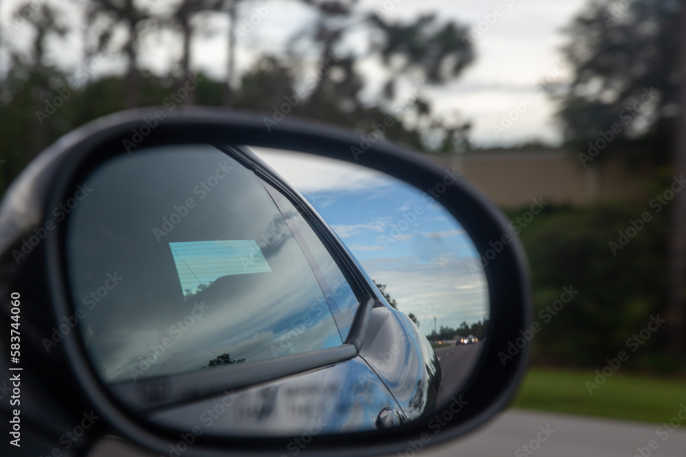 Speeding Car through a rear view mirror Speeding Car through a rear view mirror