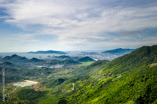 Panoramic photo of dawn viewed from the high mountains, in the distance is the famous coastal tourist city of Nha Trang