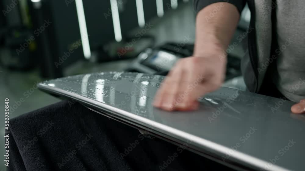 Preparation of a car spoiler for gluing a paint protection film that