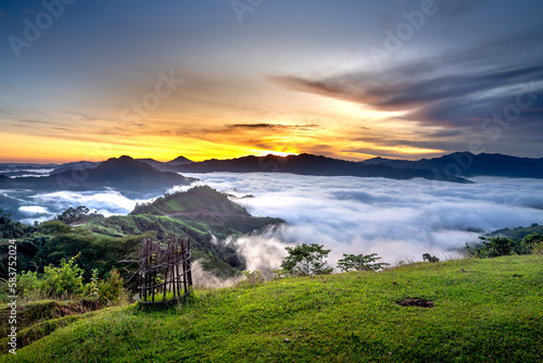 Panoramic view of sunrise with a trail going through a valley filled with white clouds in the Tak Po mountains in Tra Tap commune, Nam Tra My district, Quang Nam province, Vietnam photo