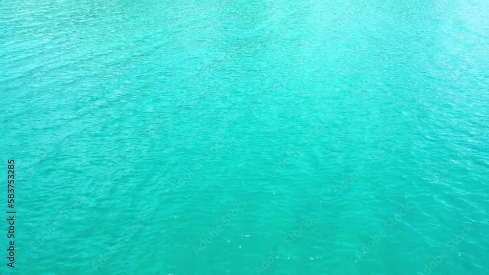 Aerial top-down view of the sea surface with deep blue water, moving forward Aerial top-down view of the sea surface with deep blue water, moving forward