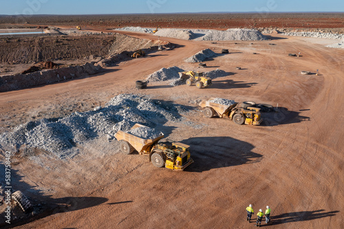 Aerial view of mining trucks at a mine site in Australia