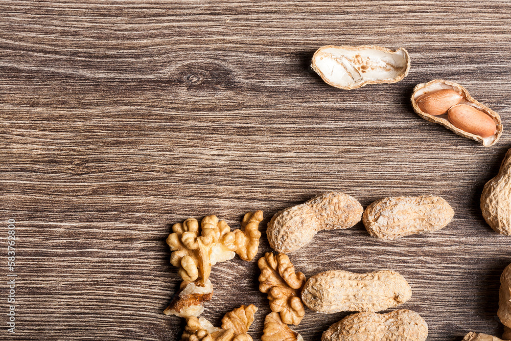 Nuts on wooden background in close up photo Nuts on wooden background in close up photo