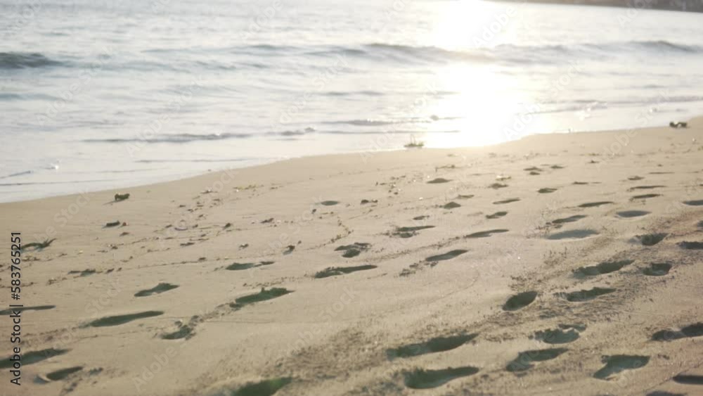 Sandy beach with footprints at sunset, Turkey, Alanya Sandy beach with footprints at sunset, Turkey, Alanya