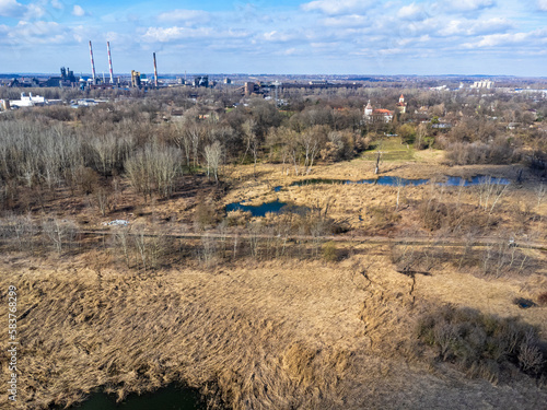 Obraz na płótnie Aerial view landscape. Factory chimneys, ponds, dry grass, industry. w salonie