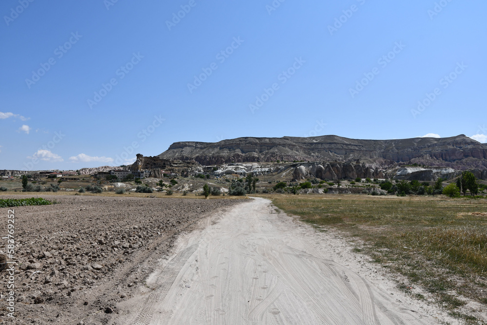 Fields and sandy paths next to Cavusin in Cappadocia, Turkey