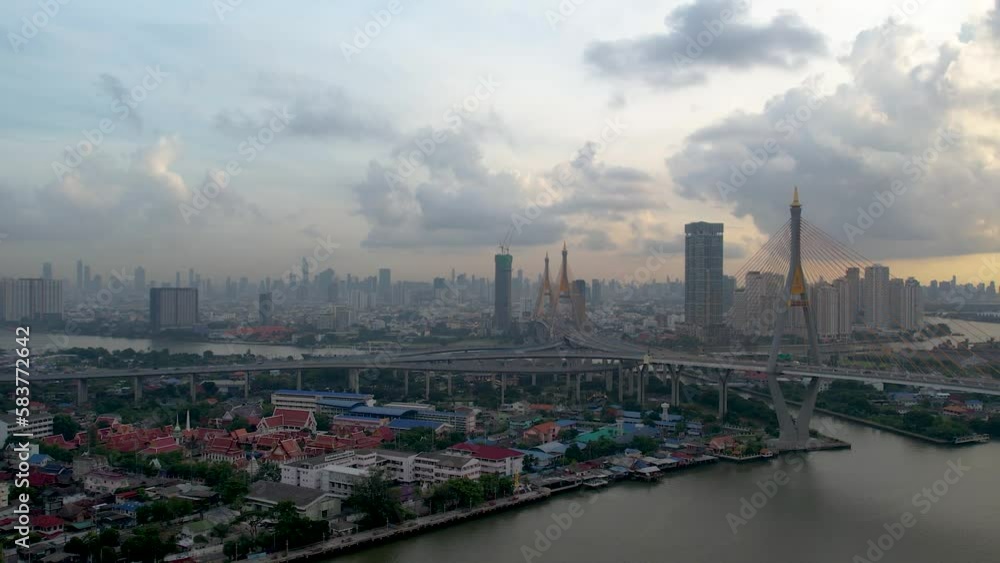 Aerial drone of bridge and Chao Phraya River in structure of suspension architecture concept, Urban city, Bangkok, Downtown area at dusk, Thailand. Aerial drone of bridge and Chao Phraya River in structure of suspension architecture concept, Urban city, Bangkok, Downtown area at dusk, Thailand.