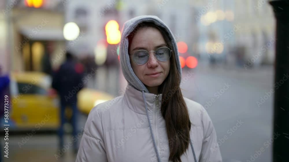 brunette lady walking in downtown in snowy winter or autumn day, slow motion, beautiful woman brunette lady walking in downtown in snowy winter or autumn day, slow motion, beautiful woman