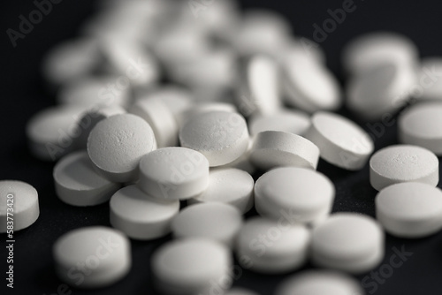 Black background white pills blur