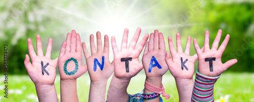 Children Hands Building Word Kontakt Means Contact, Grass Meadow