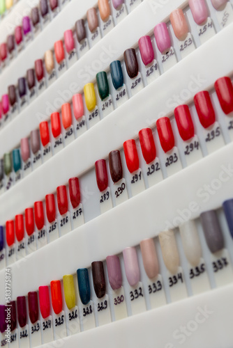 Nail polish samples of different bright colors on a white background.