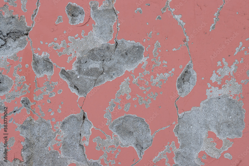 Peeling paint on the wall. Old concrete wall with cracked flaking paint