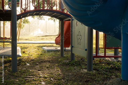 Wallpaper Mural Children playground in the park with morning sunlight. Selected focus on the swing. Torontodigital.ca