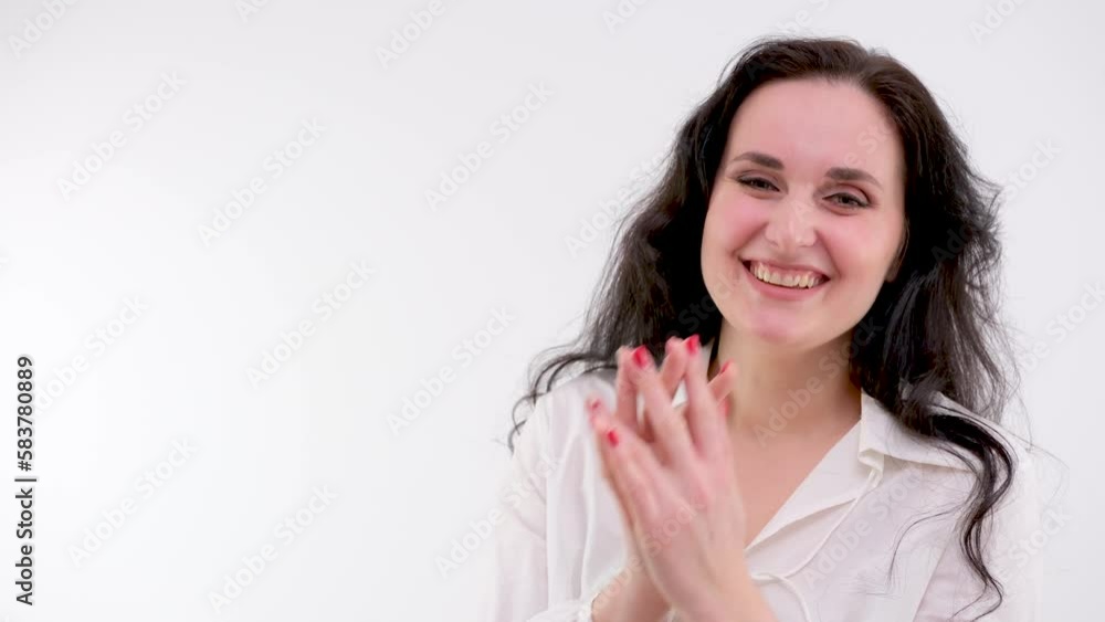 Happy woman posing on white wall. High quality 4k footage Happy woman posing on white wall. High quality 4k footage