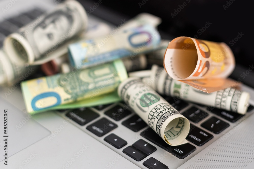 Fototapeta premium Money on computer keyboard. roll