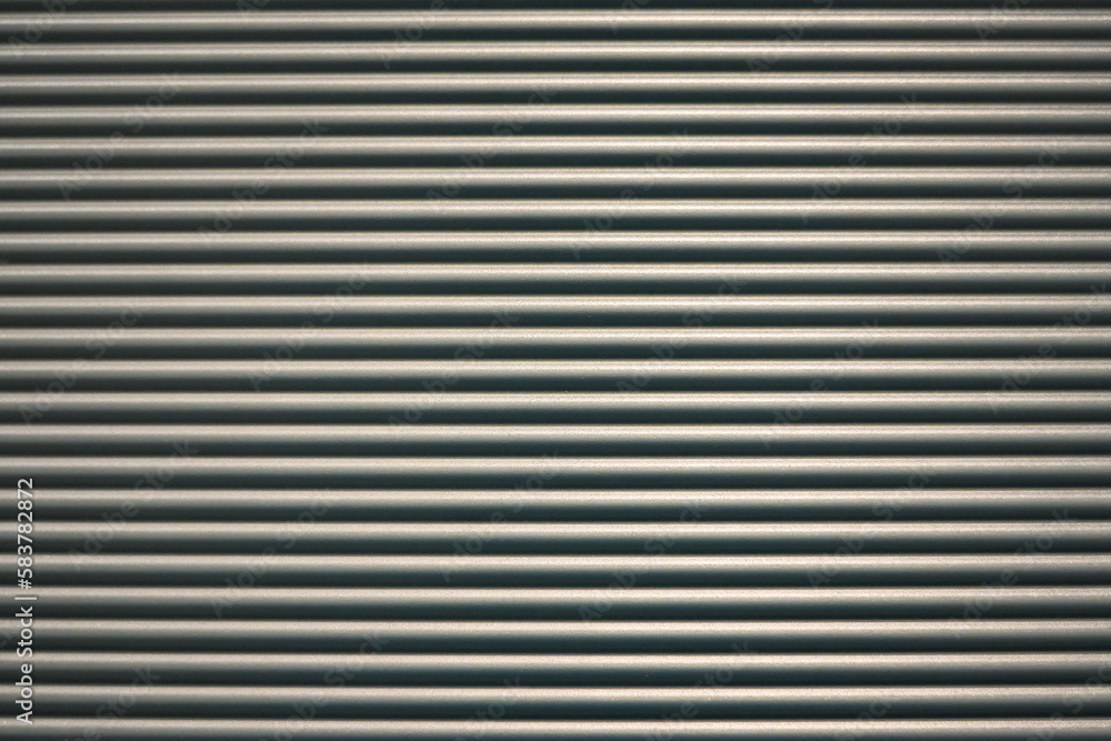 Gray corrugated metal wall. Template for background and texture. Stripes.
Gray corrugated metal wall. Template for background and texture. Stripes.