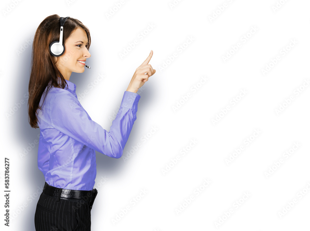 Call center service. Profile side image of customer support phone sales operator in blue cloth, headset show pointing clicking at copy space, imaginary or text, isolated white background. Call center service. Profile side image of customer support phone sales operator in blue cloth, headset show pointing clicking at copy space, imaginary or text, isolated white background.