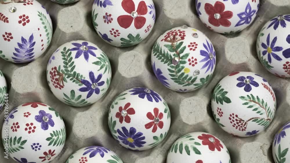 Colorful Easter eggs in the tray rotate. Happy Easter holiday concept. Easter egg is traditional symbol for religious holiday. Christian celebration traditions, flat lay top view slow motion rotation Colorful Easter eggs in the tray rotate. Happy Easter holiday concept. Easter egg is traditional symbol for religious holiday. Christian celebration traditions, flat lay top view slow motion rotation
