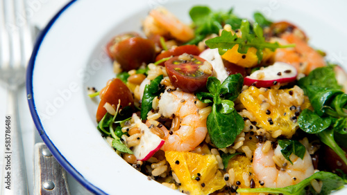 Delicious rice salad with prawns and spinach