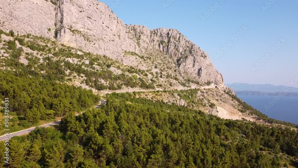 A Breathtaking Aerial View Of A Road Winding Through The Mountainside With The Stunning Mediterranean Sea In The Background In The Beautiful Country Of Croatia A Breathtaking Aerial View Of A Road Winding Through The Mountainside With The Stunning Mediterranean Sea In The Background In The Beautiful Country Of Croatia