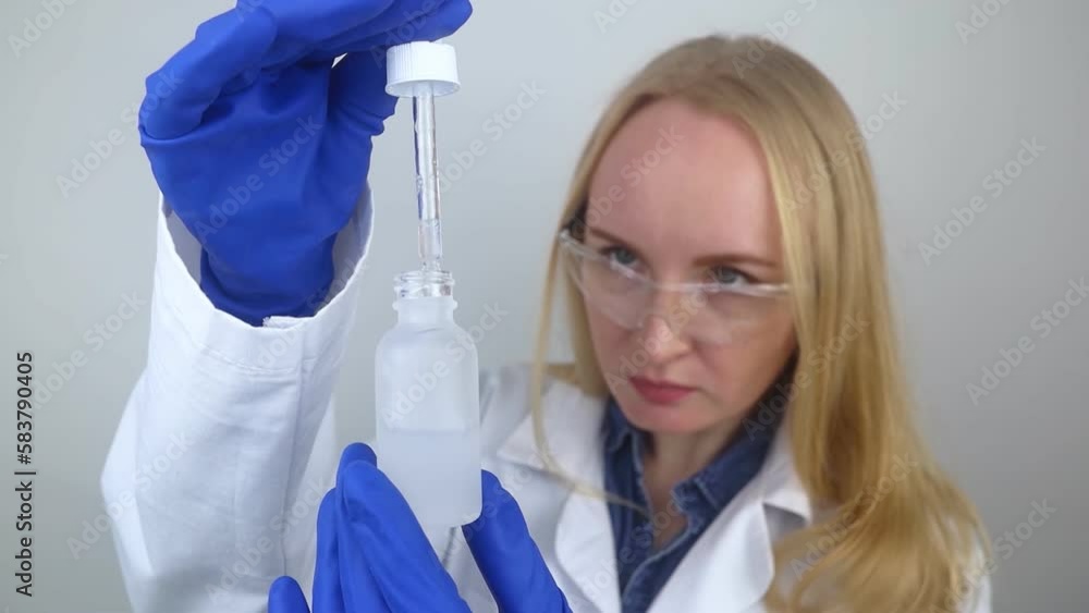 Niacinamide. Girl applies vitamin b3 to her face. Laboratory research. Skincare. Dermatological