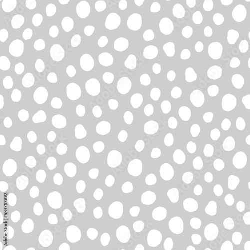 Seamless neutral polka dots pattern. White hand-drawn circles isolated on Grey background. Abstract Random points ornament. Vector illustration for wallpaper, fabric, print, wrapping paper, textile