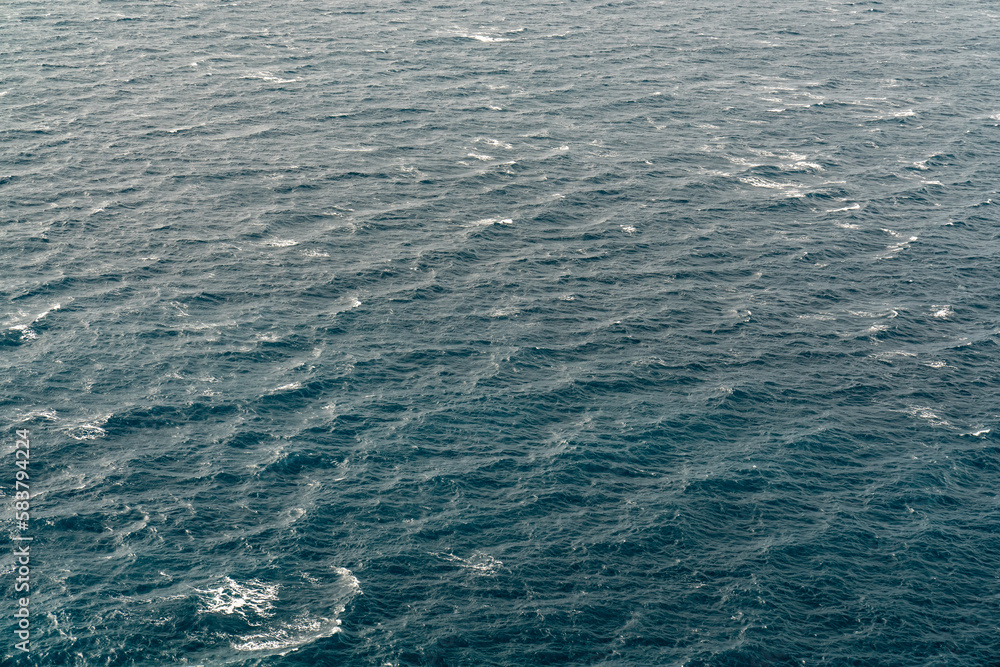 The surface of the blue sea from above. Endless sea. Waves.