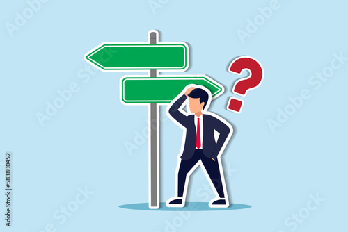 Choosing between 2 choices, make decision to the left or right, thinking in difficult situation, confusion concept, businessman thinking with question mark choose between 2 direction with copy space. 