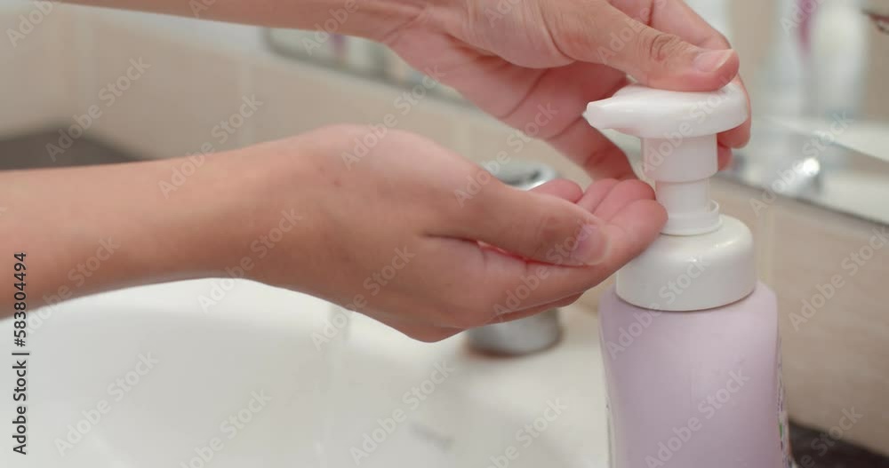 Wash your hands with clean water.Wash your hands with a foaming hand wash that makes your hands clean and fragrant.Washing our hands keeps us safe from germs.( Close up ) Wash your hands with clean water.Wash your hands with a foaming hand wash that makes your hands clean and fragrant.Washing our hands keeps us safe from germs.( Close up )