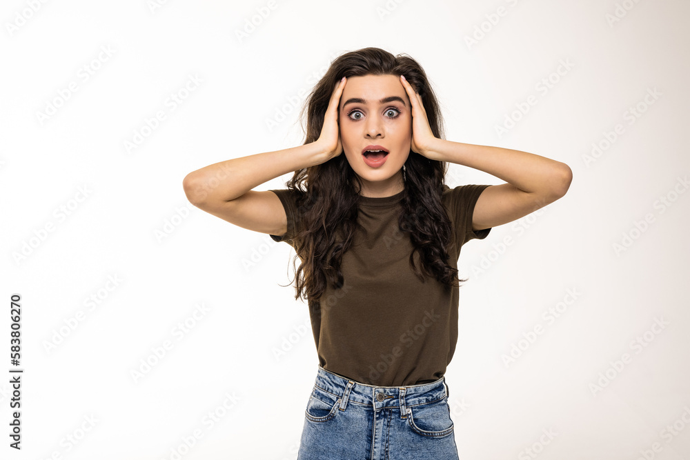 Amazed woman looking at camera on a white background Amazed woman looking at camera on a white background