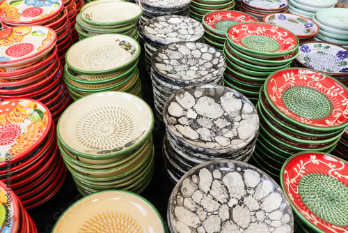 multi-colored ceramic plates with a grater for garlic and cheese