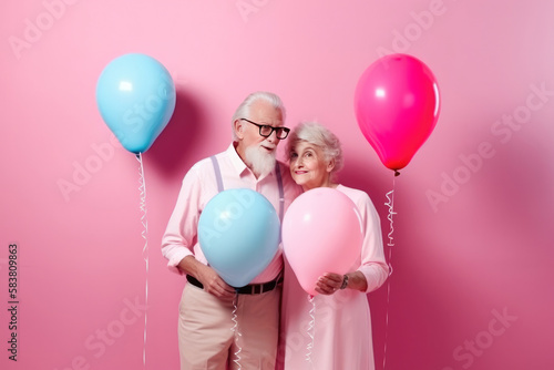 Happy retired married couple in love and in matching pastel colored outfit, holding some balloons. Generative AI photo