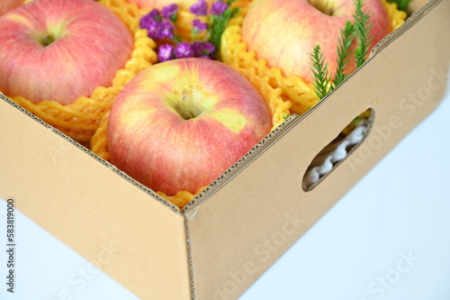 beautiful pink apple in the box on white background